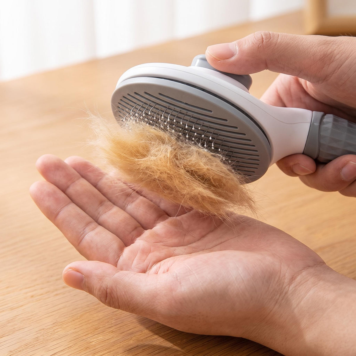 Press the button and the collected hair slides off